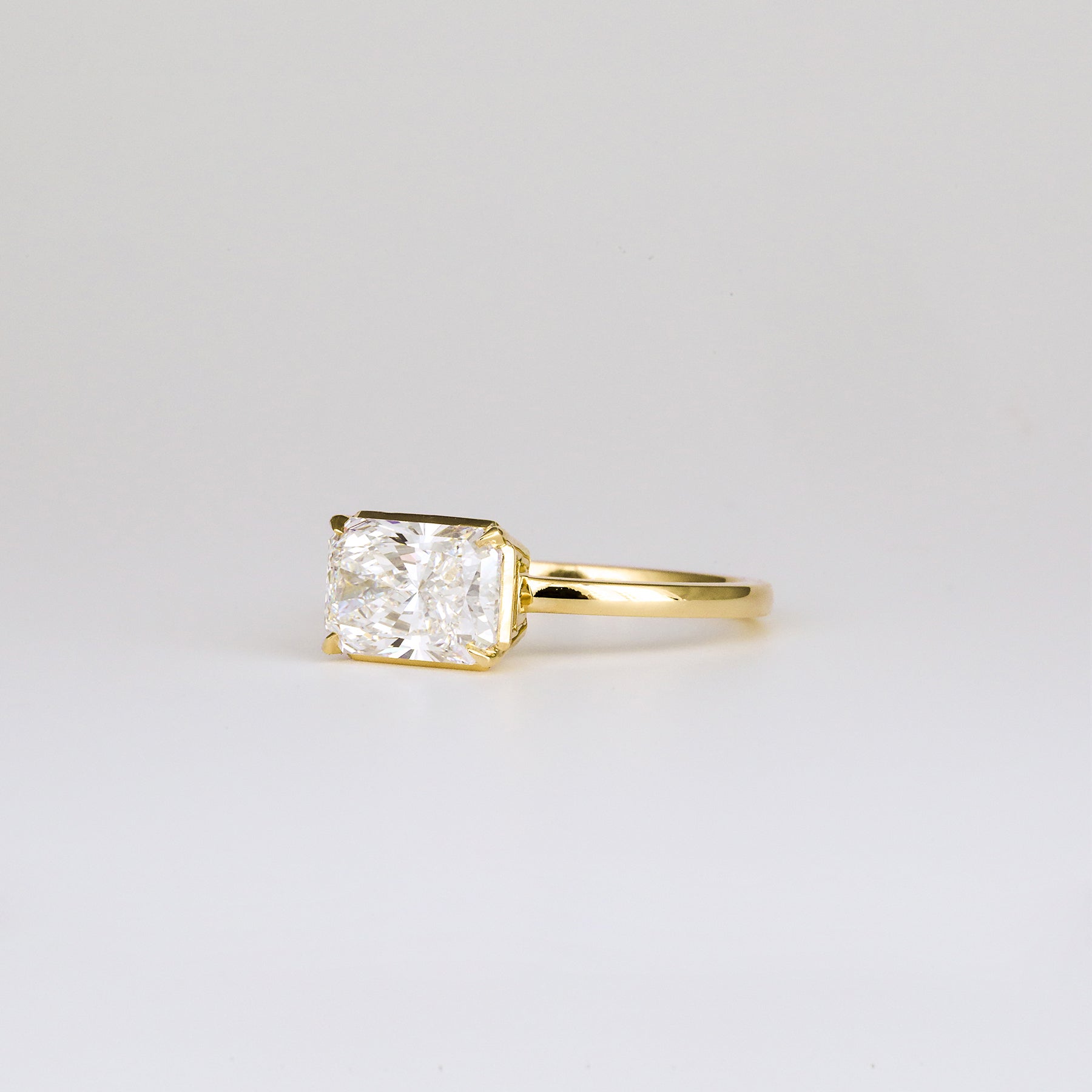 Aaren East-West Radiant Cut 2.01ct Lab Grown Diamond Solitaire Ring in Yellow Gold