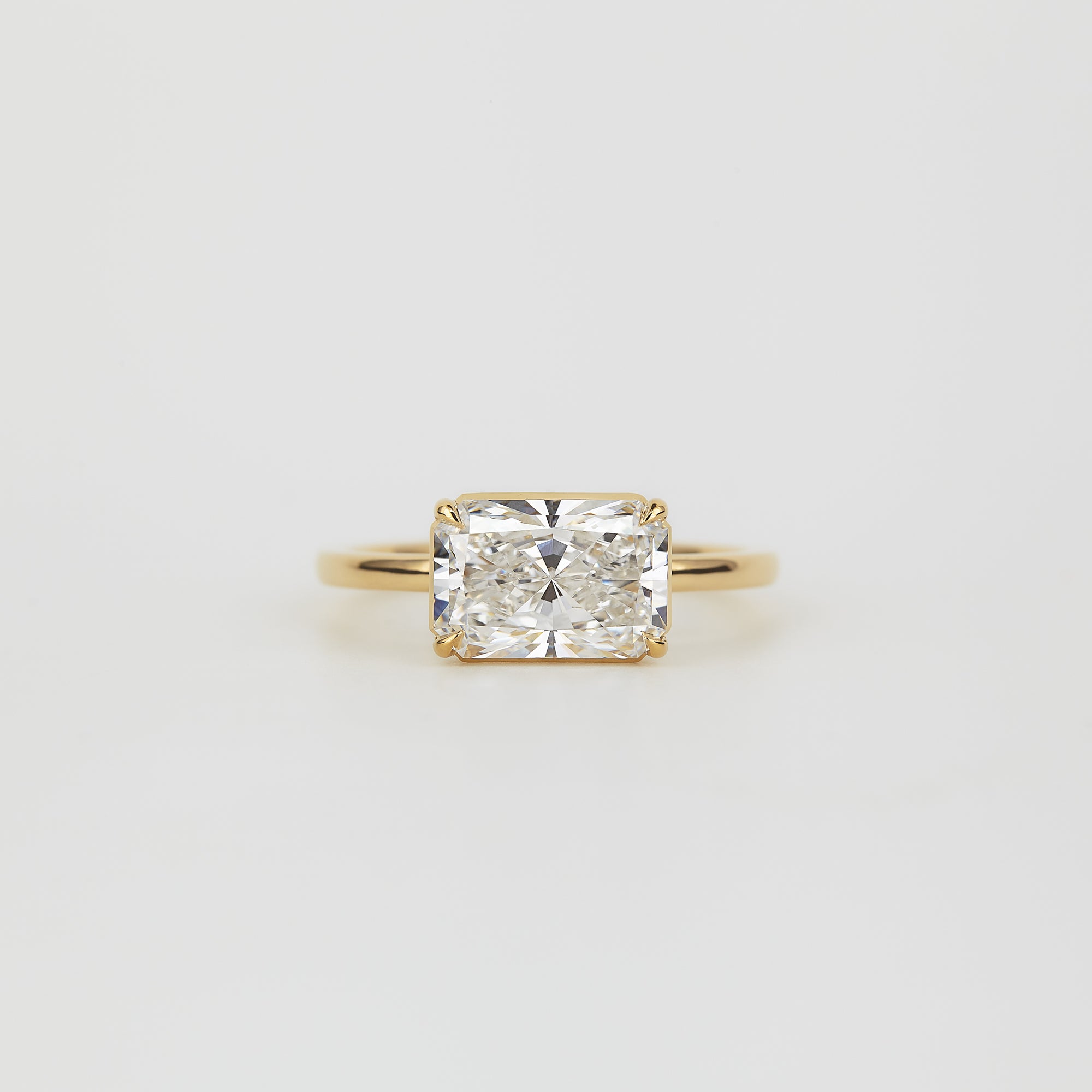 Aaren East-West Radiant Cut 2.38ct Lab Grown Diamond Solitaire Ring in Yellow Gold